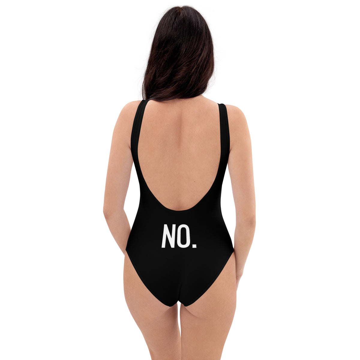 Model is wearing back facing adult graphic one-piece swimsuit in color black, featuring the statement 'NO.' in bold white print. From What Was Said (Statement Apparel + More).