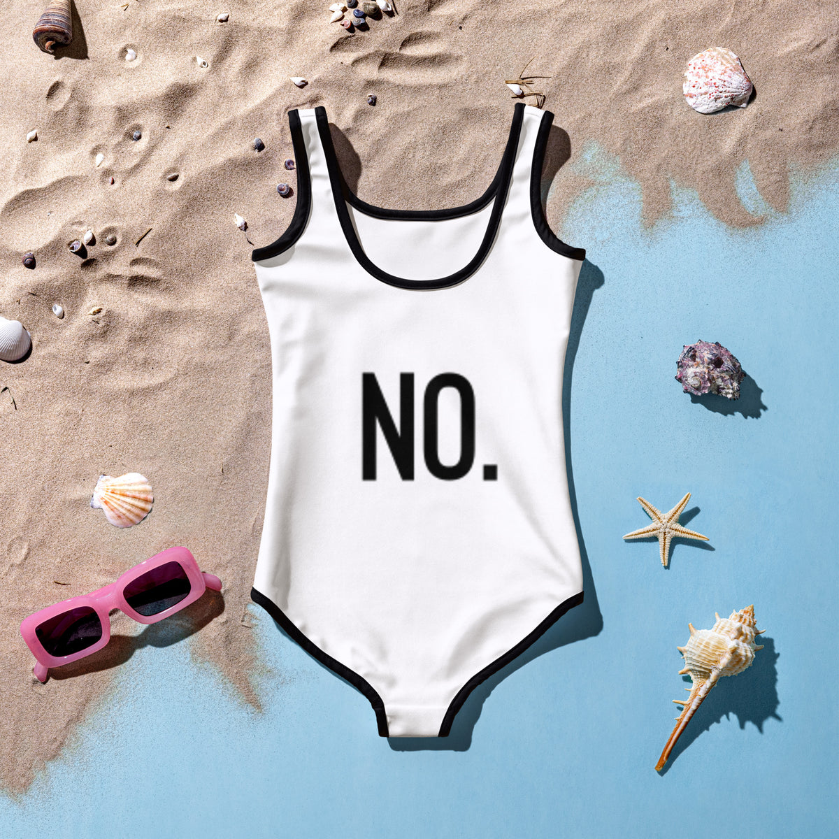 Back facing kids graphic one-piece swimsuit in color white with black trim, featuring the statement 'NO.' in bold black print. From What Was Said (Statement Apparel + More).
