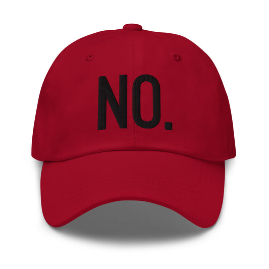 Model is wearing front facing graphic dad hat in color cranberry red, featuring the statement 'NO.' in bold black embroidery. From What Was Said (Statement Apparel + More).