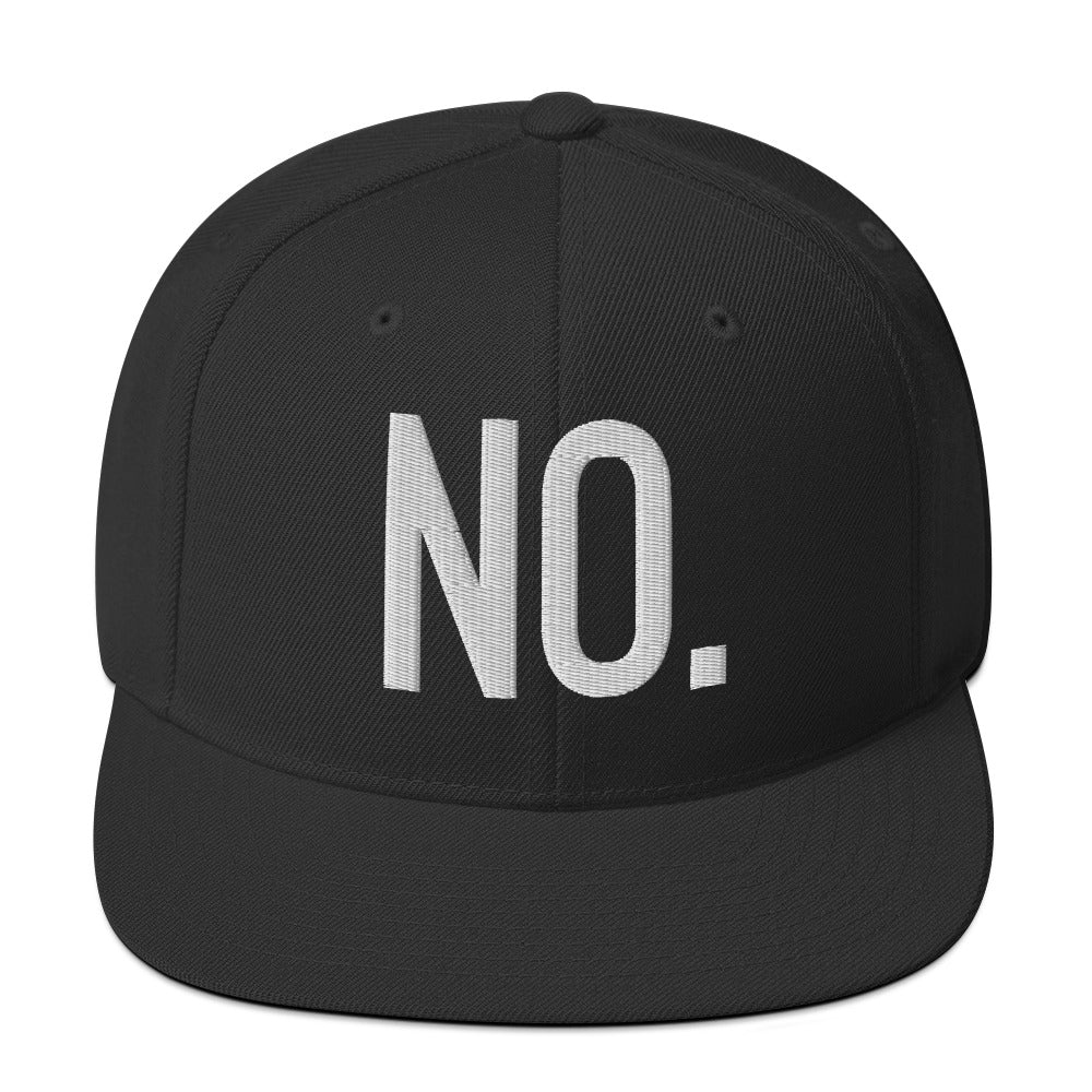 Front facing graphic snapback hat in color black, featuring the statement 'NO.' in bold white embroidery. From What Was Said (Statement Apparel + More).