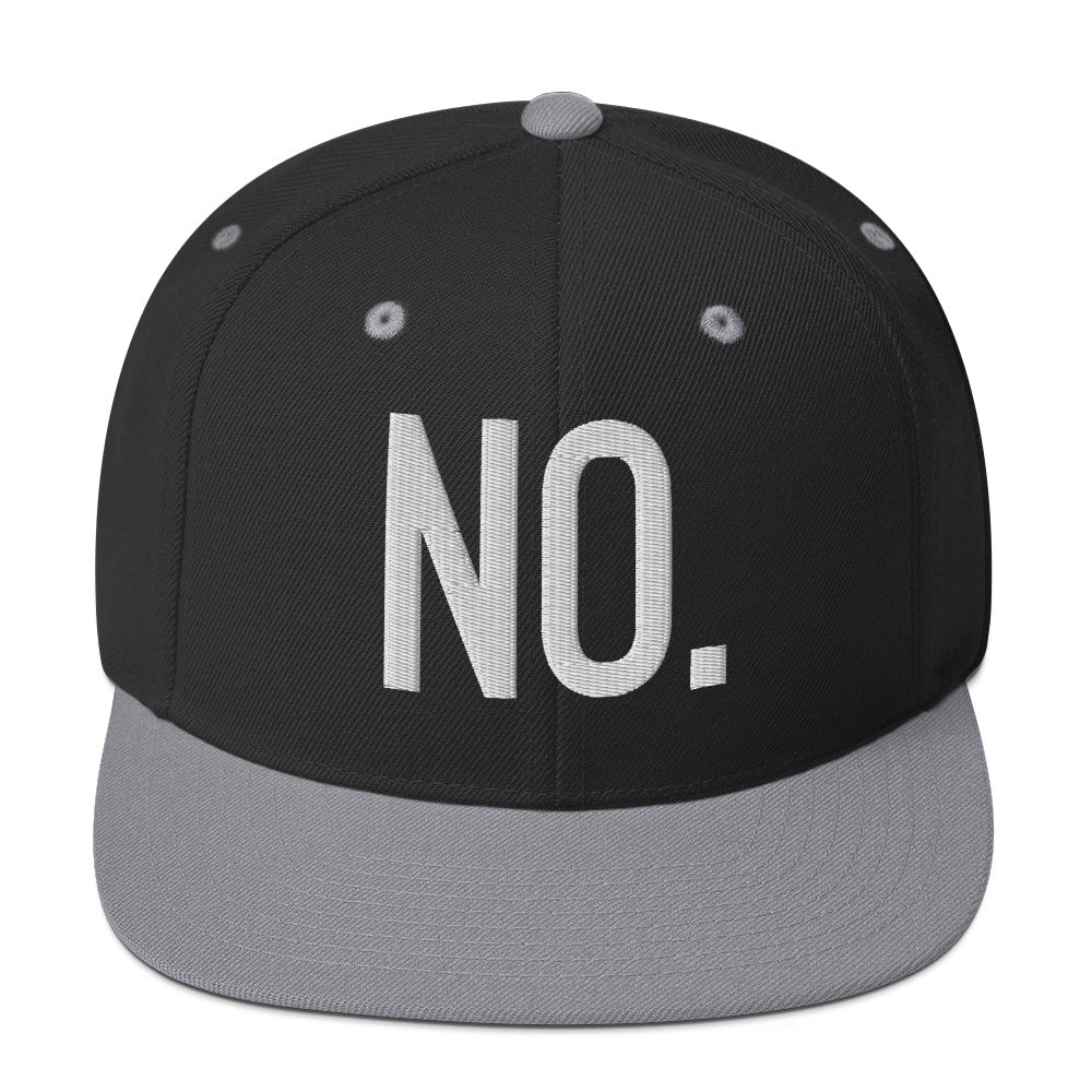Front facing graphic snapback hat in color black and silver light grey, featuring the statement 'NO.' in bold white embroidery. From What Was Said (Statement Apparel + More).