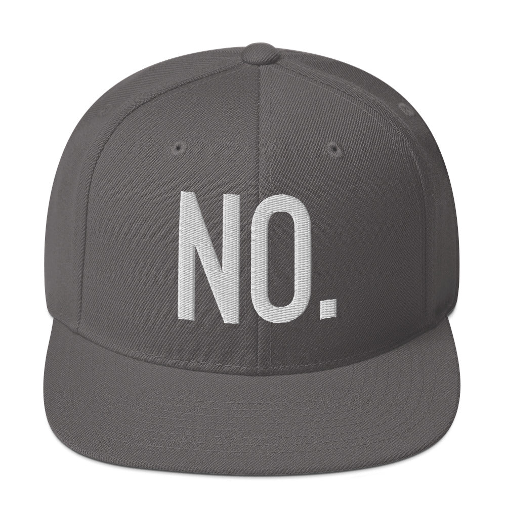 Front facing graphic snapback hat in color dark grey, featuring the statement 'NO.' in bold white embroidery. From What Was Said (Statement Apparel + More).