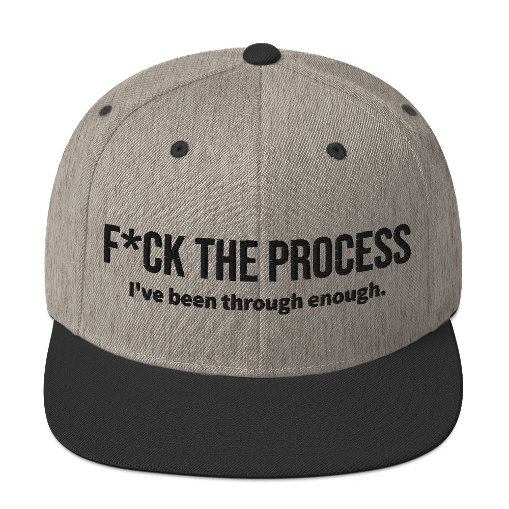 Front facing graphic snapback hat in color heather grey and black, featuring the statement 'FUCK THE PROCESS, I've Been Through Enough,' in bold black embroidery. From What Was Said (Statement Apparel + More).