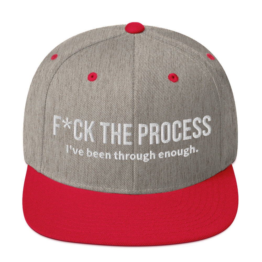 Front facing graphic snapback hat in color heather grey and red, featuring the statement 'FUCK THE PROCESS, I've Been Through Enough,' in bold white embroidery. From What Was Said (Statement Apparel + More).