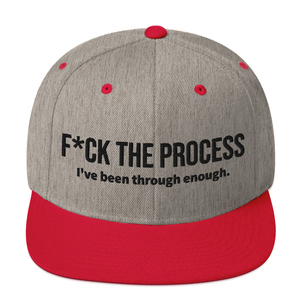 Front facing graphic snapback hat in color heather grey and red, featuring the statement 'FUCK THE PROCESS, I've Been Through Enough,' in bold black embroidery. From What Was Said (Statement Apparel + More).