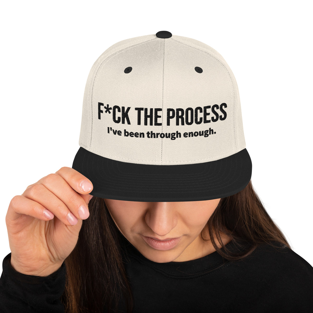 Model is wearing front facing graphic snapback hat in color natural and black, featuring the statement 'FUCK THE PROCESS, I've Been Through Enough,' in bold black embroidery. From What Was Said (Statement Apparel + More).