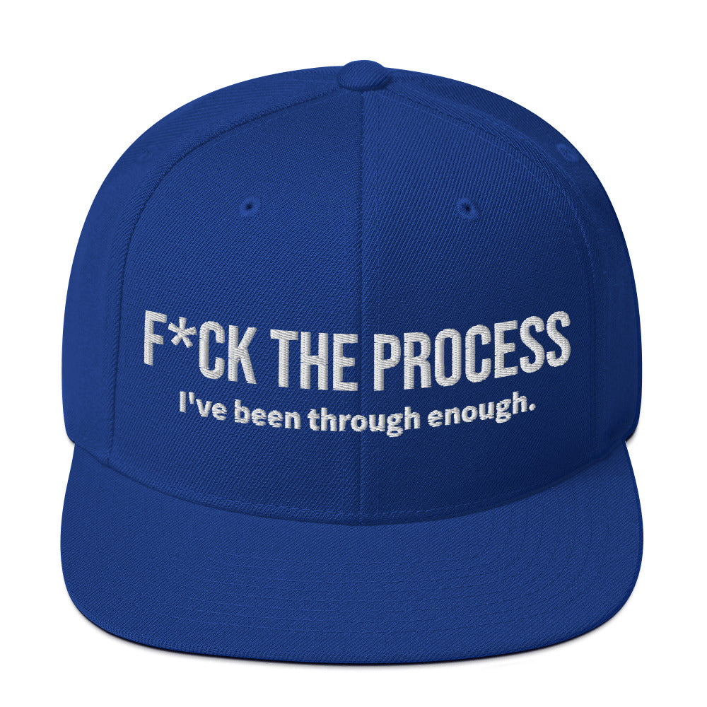 Front facing graphic snapback hat in color royal blue, featuring the statement 'FUCK THE PROCESS, I've Been Through Enough,' in bold white embroidery. From What Was Said (Statement Apparel + More).