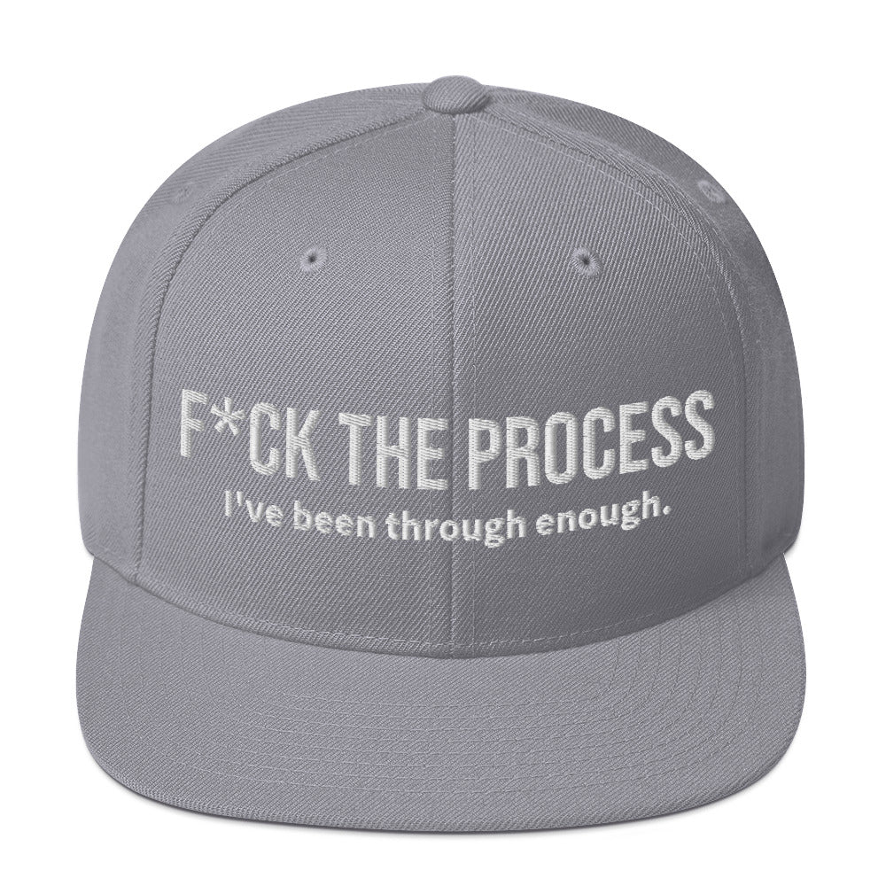 Front facing graphic snapback hat in color silver light grey, featuring the statement 'FUCK THE PROCESS, I've Been Through Enough,' in bold white embroidery. From What Was Said (Statement Apparel + More).