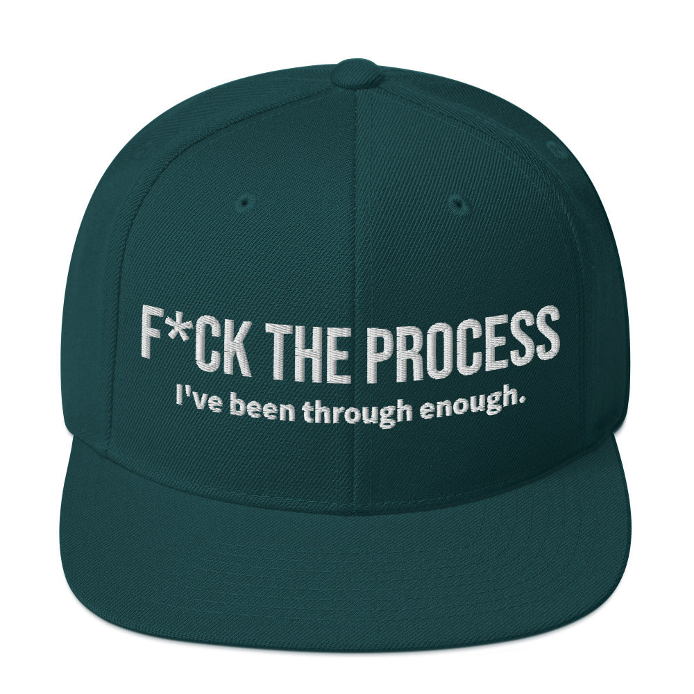 Front facing graphic snapback hat in color spruce green, featuring the statement 'FUCK THE PROCESS, I've Been Through Enough,' in bold white embroidery. From What Was Said (Statement Apparel + More).