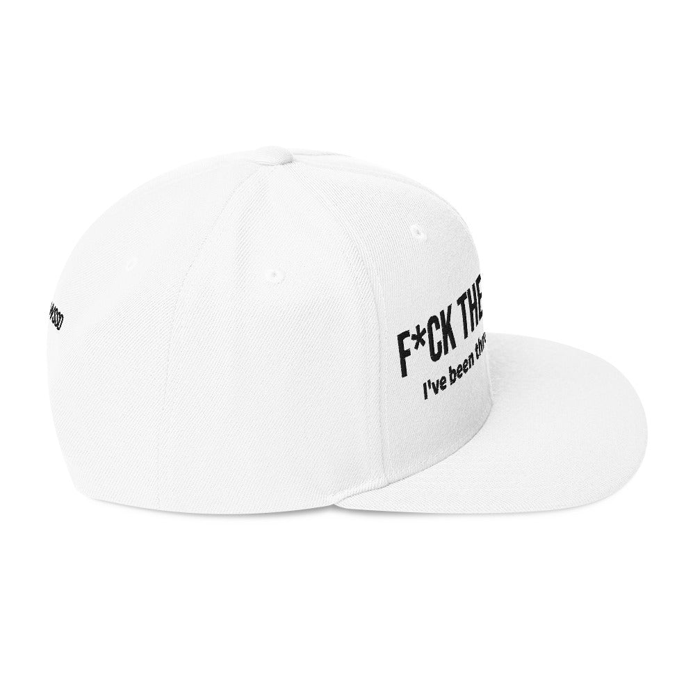 Right side facing graphic snapback hat in color white, featuring the statement 'FUCK THE PROCESS, I've Been Through Enough,' in bold black embroidery on the front of the hat. From What Was Said (Statement Apparel + More).