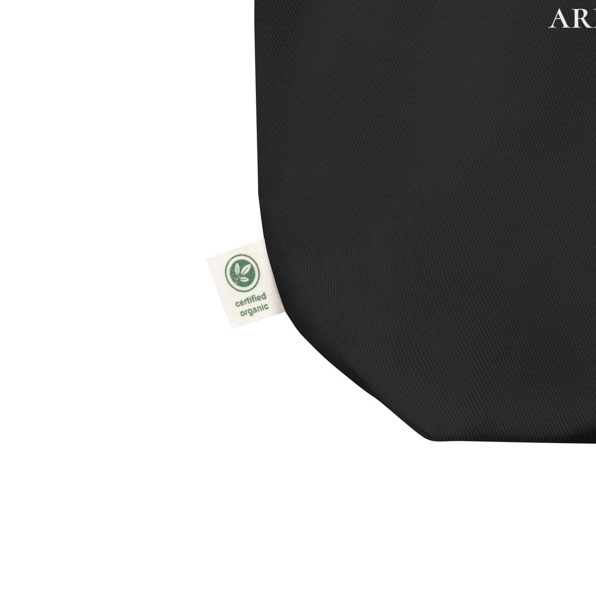 Product detail on graphic eco tote bag in color black, shows the certified organic label. From What Was Said (Statement Apparel + More). 