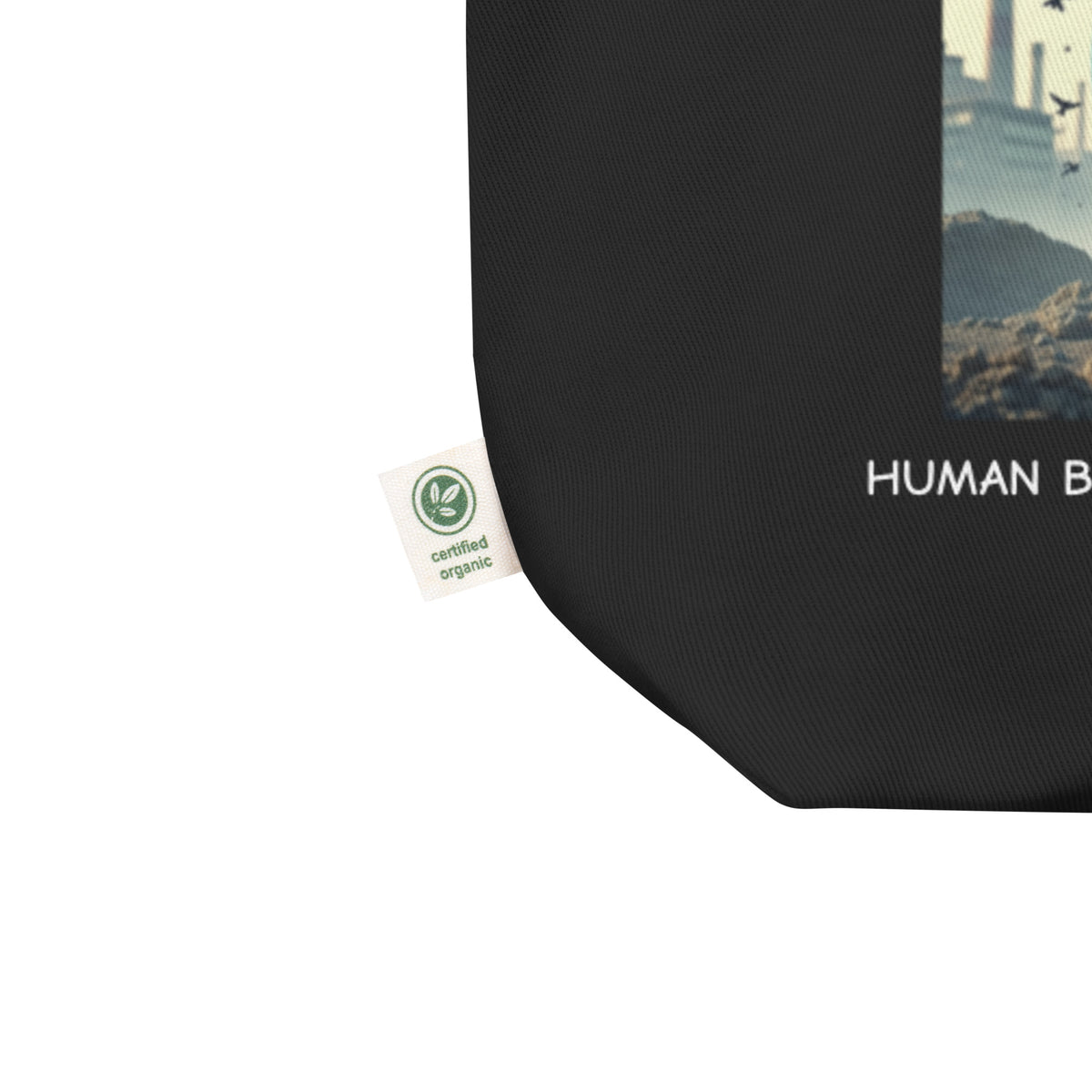 Product detail on graphic eco tote bag in color black, shows the certified organic label. From What Was Said (Statement Apparel + More). 