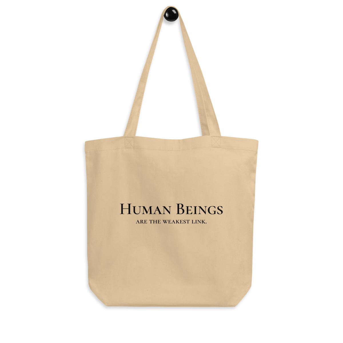 Front-facing graphic eco tote bag in color oyster beige, featuring a bold statement, 'Human Beings Are The Weakest link', in bold black print, from What Was Said (Statement Apparel + More). 