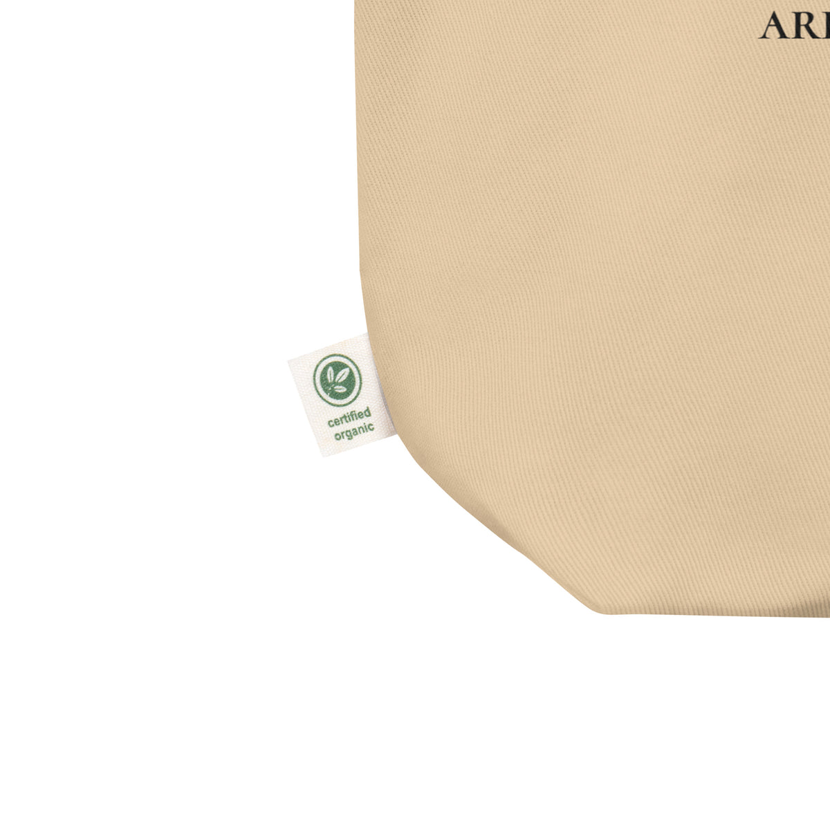 Product detail on graphic eco tote bag in color oyster beige, shows the certified organic label. From What Was Said (Statement Apparel + More). 