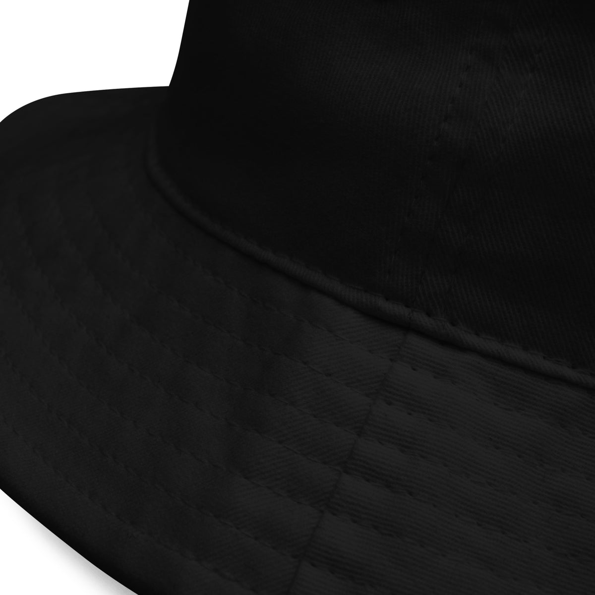 Product detail of graphic bucket hat in color black, featuring quality stitching on hats brim. From What Was Said (Statement Apparel + More).