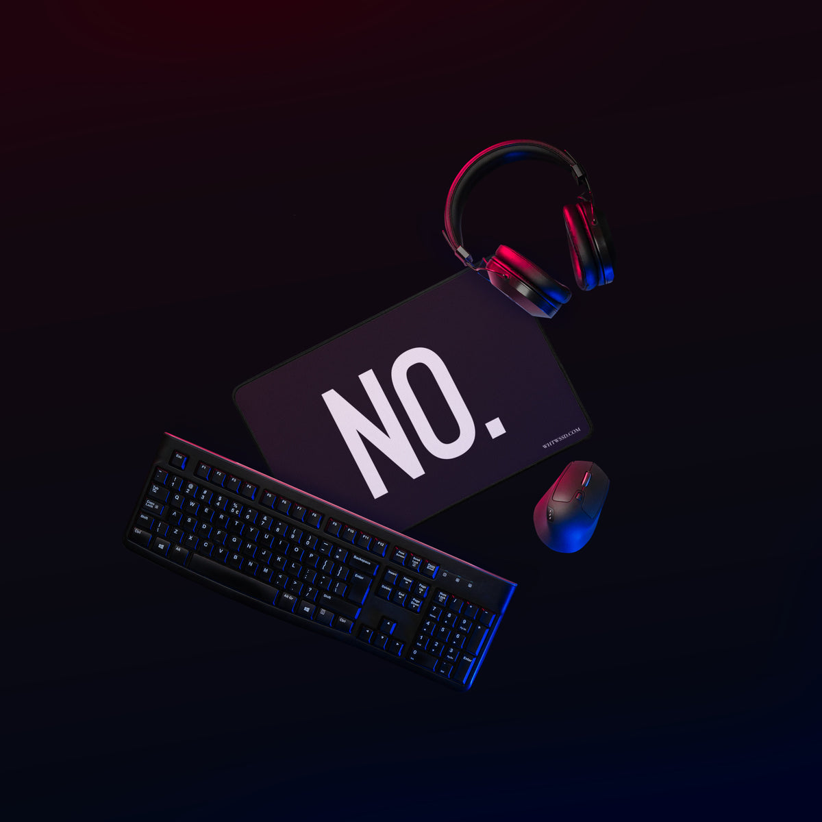 Front facing 12x18 graphic desk mat in color black, against black background.  Featuring the statement 'NO.' in bold white print, and brand logo website, WHTWSSD.COM in small print in the bottom left corner. From What Was Said (Statement Apparel + More). 