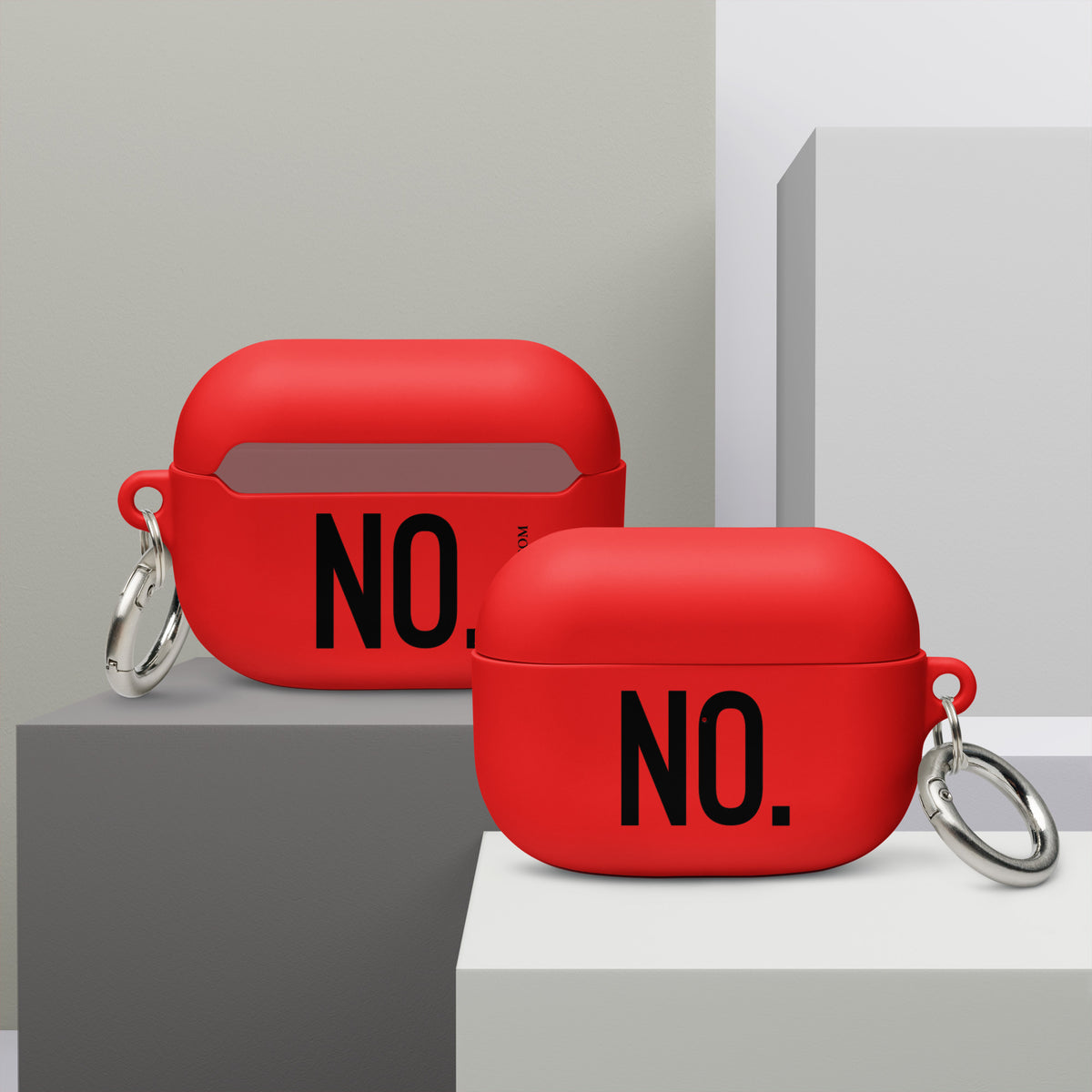 Front and back facing AirPods Pro graphic rubber cases in color red, featuring the statement 'NO" in bold black print on both sides, and the brand logo WHTWSSD.COM on the back. From What Was Said (Statement Apparel + More). 