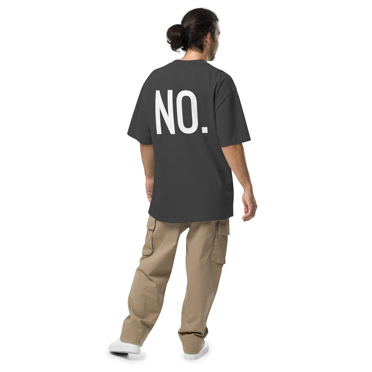 Model wearing back facing oversized fit graphic t-shirt in color faded black, featuring the statement 'NO,' in bold white print. From What Was Said (Statement Apparel + More). 