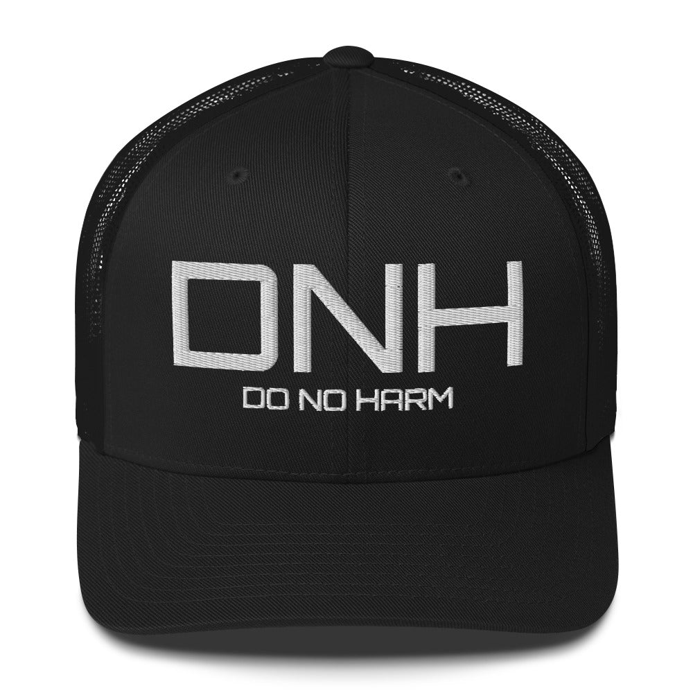 Front facing graphic trucker hat in black, featuring the initialism 'DNH', and the statement 'DO NO HARM,' in bold white embroidery. From What Was Said (Statement Apparel + More).