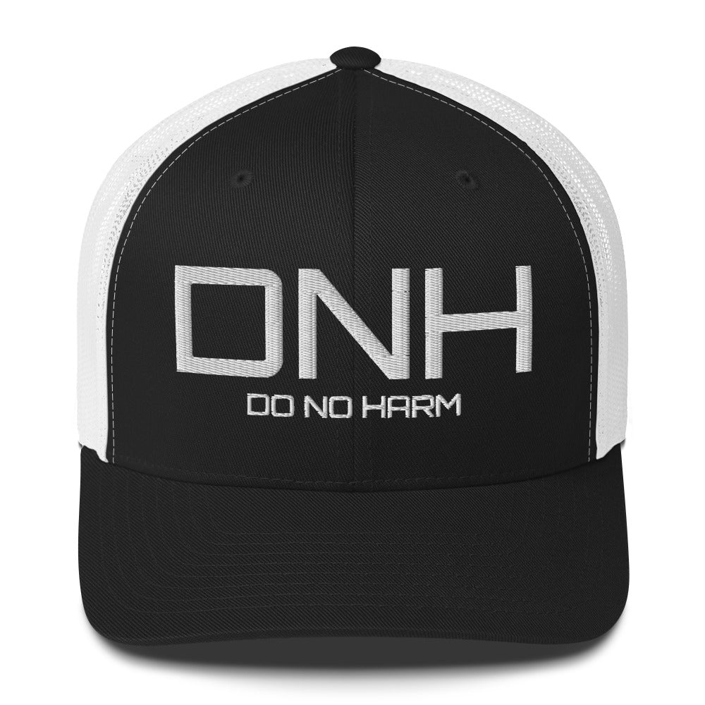 Front facing graphic trucker hat in black and white, featuring the initialism 'DNH', and the statement 'DO NO HARM,' in bold white embroidery. From What Was Said (Statement Apparel + More).