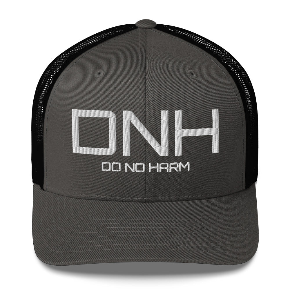 Front facing graphic trucker hat in color charcoal black, featuring the initialism 'DNH', and the statement 'DO NO HARM,' in bold white embroidery. From What Was Said (Statement Apparel + More).