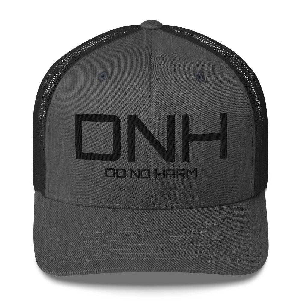 Front facing graphic trucker hat in color dark heather grey, featuring the initialism 'DNH', and the statement 'DO NO HARM,' in bold black embroidery. From What Was Said (Statement Apparel + More).