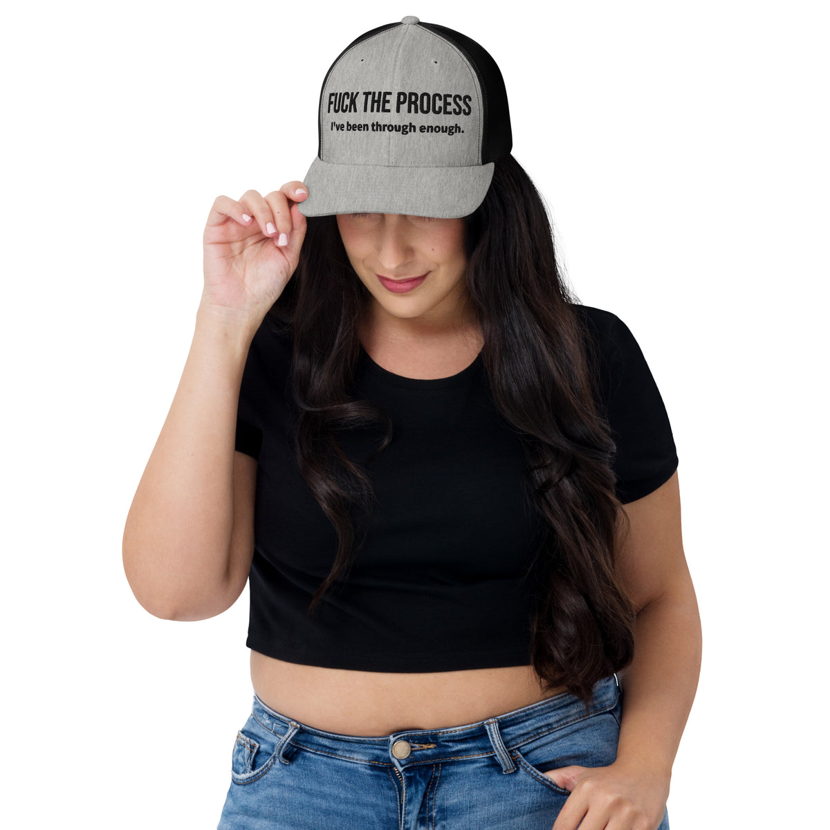 Model is wearing front facing graphic trucker hat in color heather grey and black, featuring the statement 'FUCK THE PROCESS, I've Been Through Enough,' in bold black embroidery. From What Was Said (Statement Apparel + More).