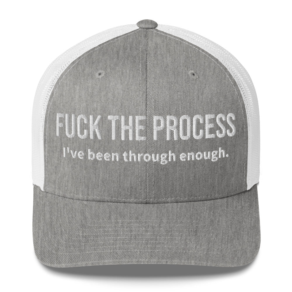 Front facing graphic trucker hat in color heather grey and white, featuring the statement 'FUCK THE PROCESS, I've Been Through Enough,' in bold white embroidery. From What Was Said (Statement Apparel + More).