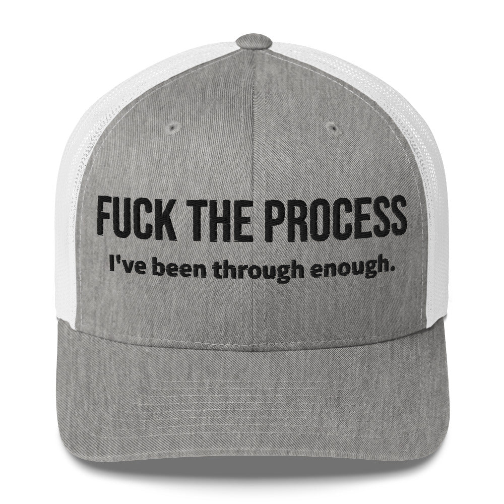 Front facing graphic trucker hat in color heather grey and white, featuring the statement 'FUCK THE PROCESS, I've Been Through Enough,' in bold black embroidery. From What Was Said (Statement Apparel + More).