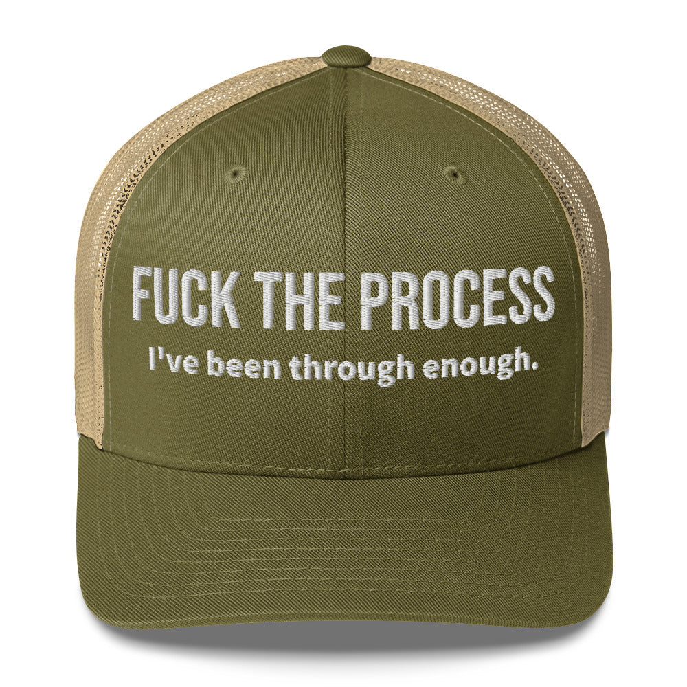 Front facing graphic trucker hat in color moss green and khaki, featuring the statement 'FUCK THE PROCESS, I've Been Through Enough,' in bold white embroidery. From What Was Said (Statement Apparel + More).