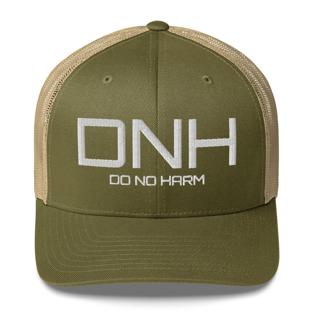 Front facing graphic trucker hat in color moss green and khaki, featuring the initialism 'DNH', and the statement 'DO NO HARM,' in bold white embroidery. From What Was Said (Statement Apparel + More).