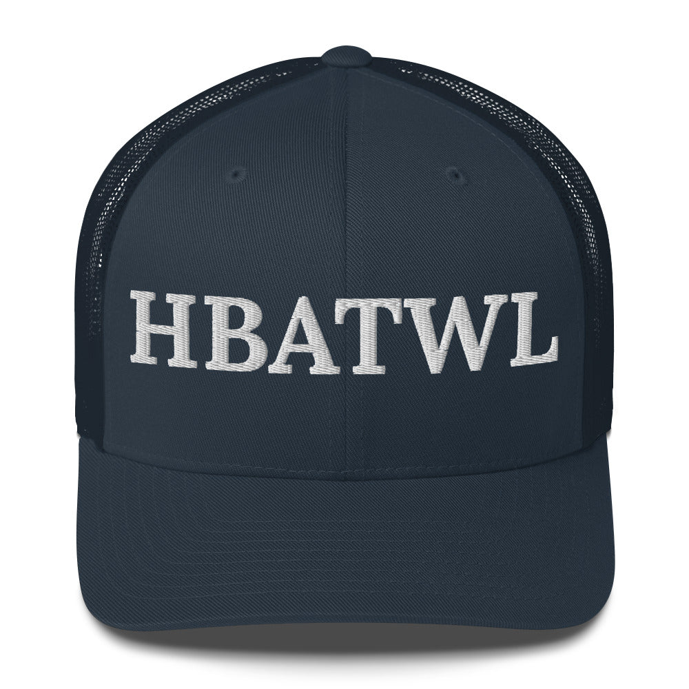 Front facing graphic trucker hat in color navy blue, featuring the initialism 'HBATWL', in bold white embroidery. From What Was Said (Statement Apparel + More).