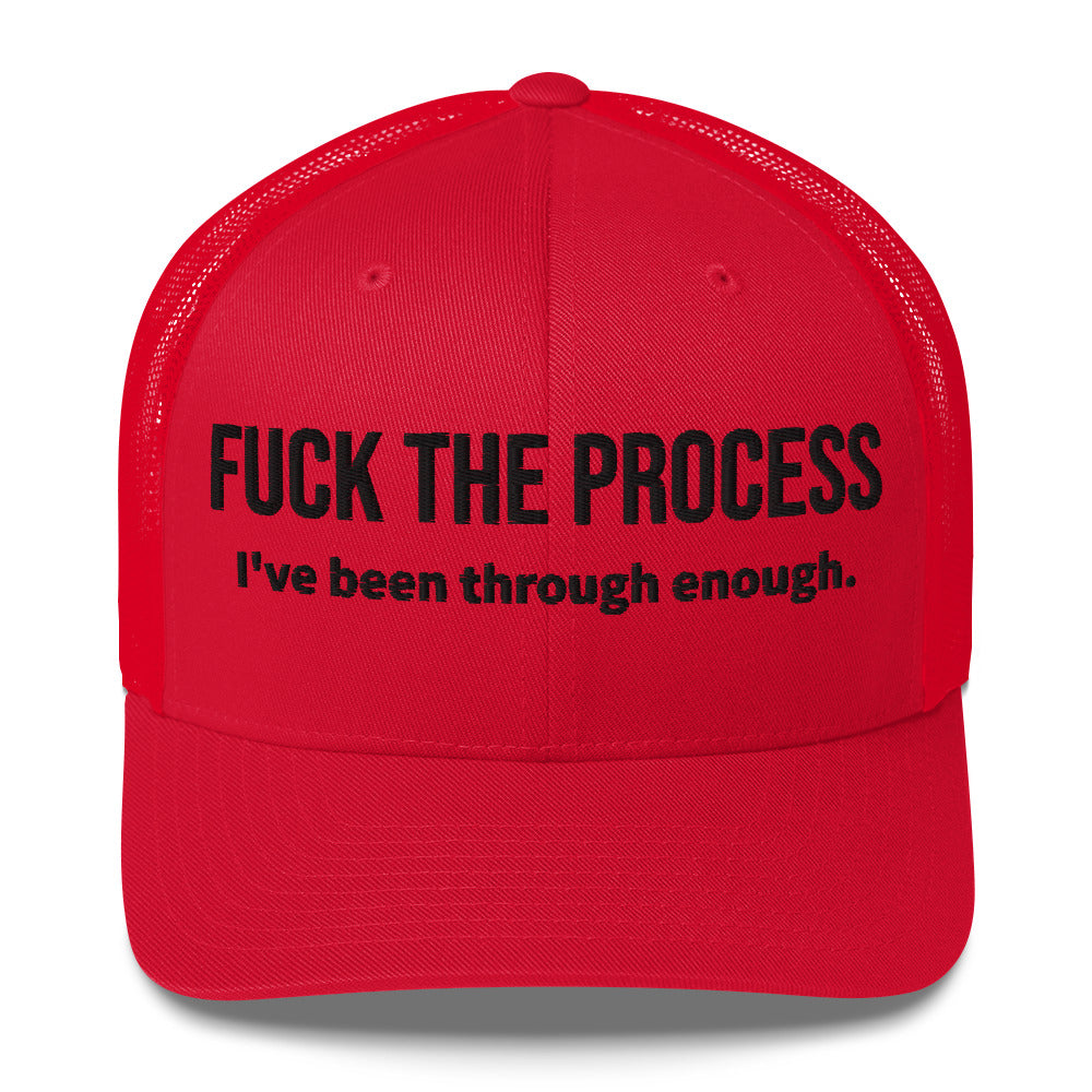 Front facing graphic trucker hat in color red, featuring the statement 'FUCK THE PROCESS, I've Been Through Enough,' in bold black embroidery. From What Was Said (Statement Apparel + More).