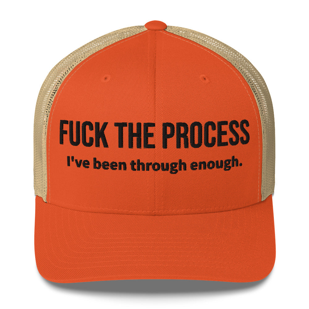 Front facing graphic trucker hat in color rustic orange and khaki, featuring the statement 'FUCK THE PROCESS, I've Been Through Enough,' in bold black embroidery. From What Was Said (Statement Apparel + More).
