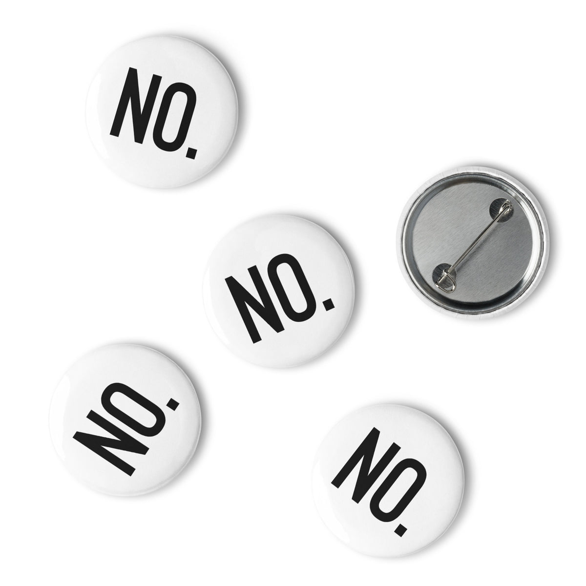 Front and back facing graphic pin buttons against a white background. Buttons are in color white and size 1.25 inches. Featuring a safety pin type clasp, and the statement 'NO.' in bold black print. From What Was Said (Statement Apparel + More). 