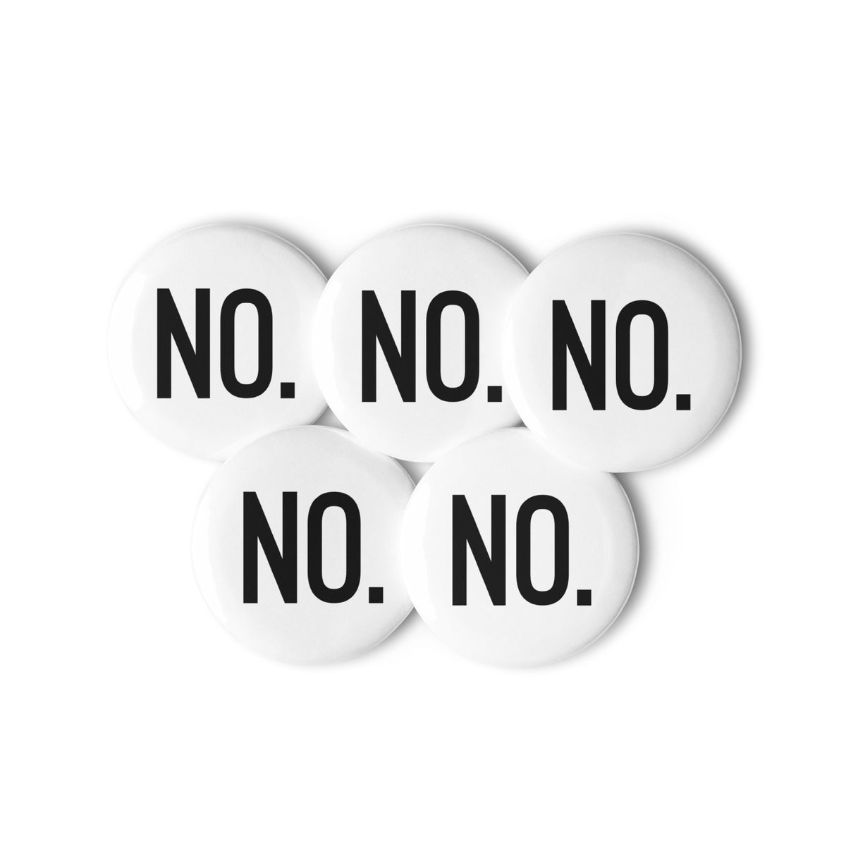 Front facing graphic pin buttons against a white background. Buttons are in color white and size 1.25 inches. Featuring the statement 'NO.' in bold black print. From What Was Said (Statement Apparel + More). 