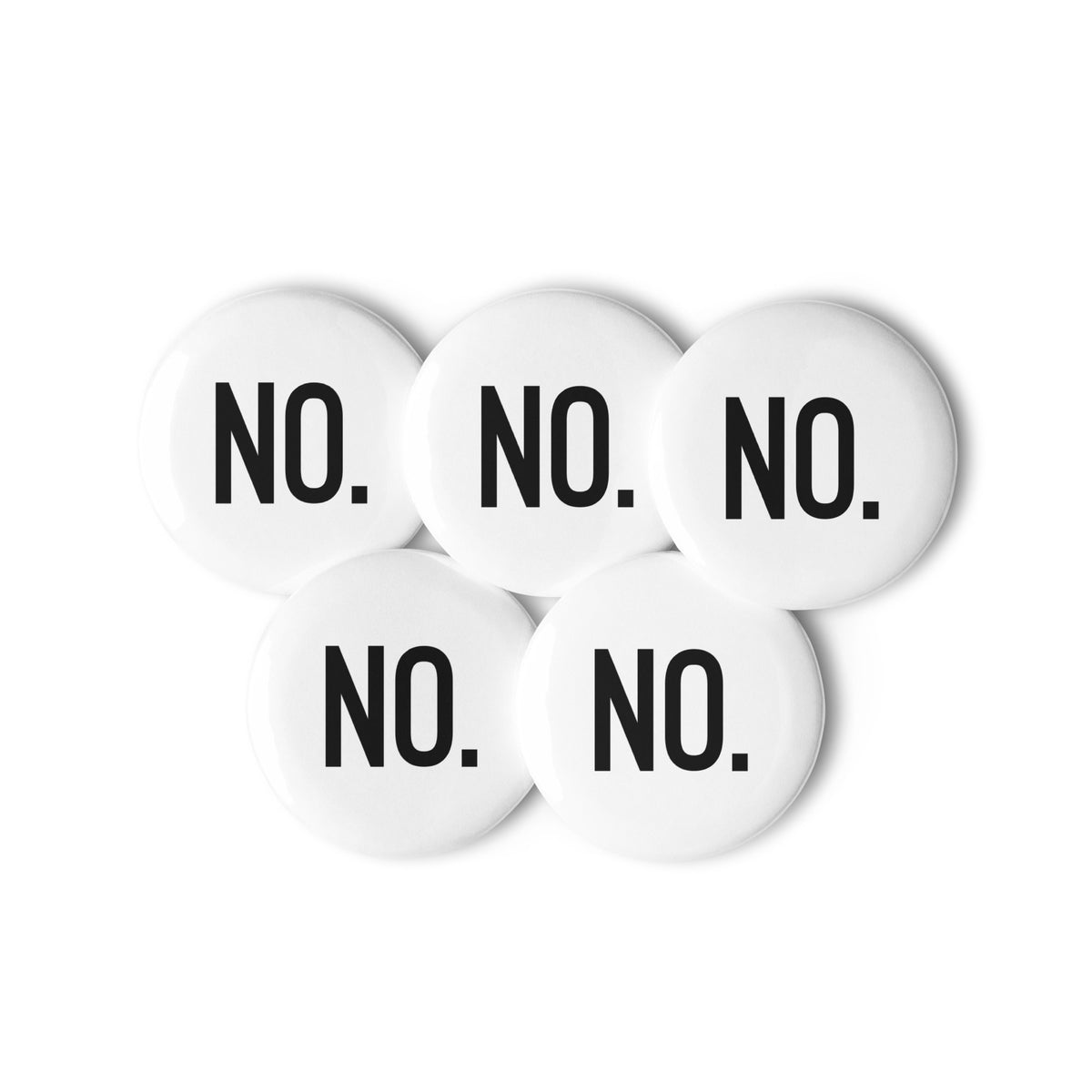 Front facing graphic pin buttons against a white background. Buttons are in color white and size 2.25 inches. Featuring the statement 'NO.' in bold black print. From What Was Said (Statement Apparel + More). 