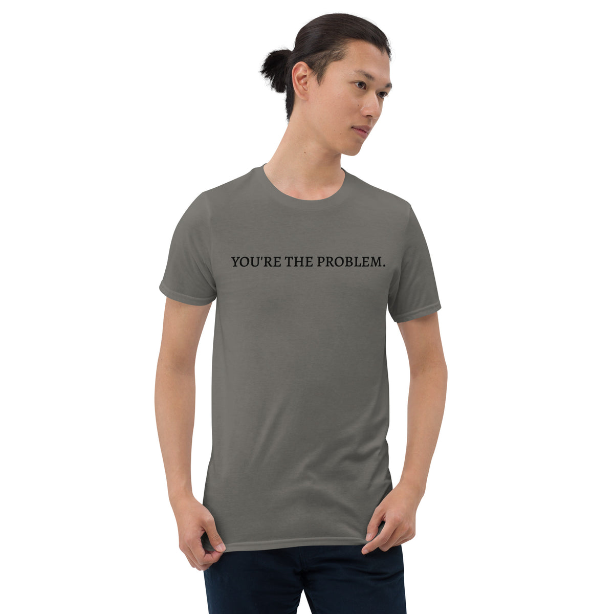 Model wearing front facing graphic t-shirt in color charcoal grey featuring statement, 'YOU'RE THE PROBLEM', in bold black print. From What Was Said (Statement Apparel + More).
