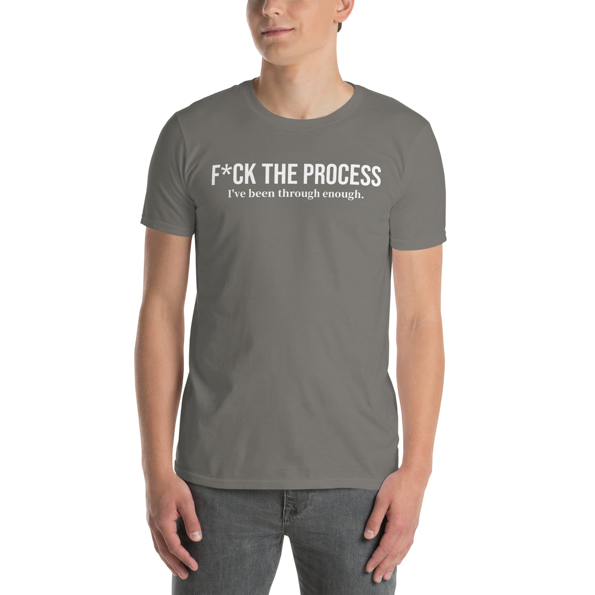 Model wearing front facing graphic t-shirt in color charcoal grey, featuring statement, 'F*CK THE PROCESS, I've been through enough', in bold white print. From What Was Said (Statement Apparel + More).