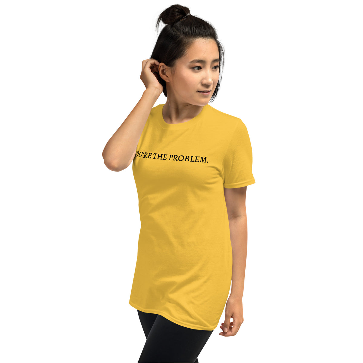 Model wearing left front facing graphic t-shirt in color daisy yellow featuring statement, 'YOU'RE THE PROBLEM', in bold black print. From What Was Said (Statement Apparel + More).
