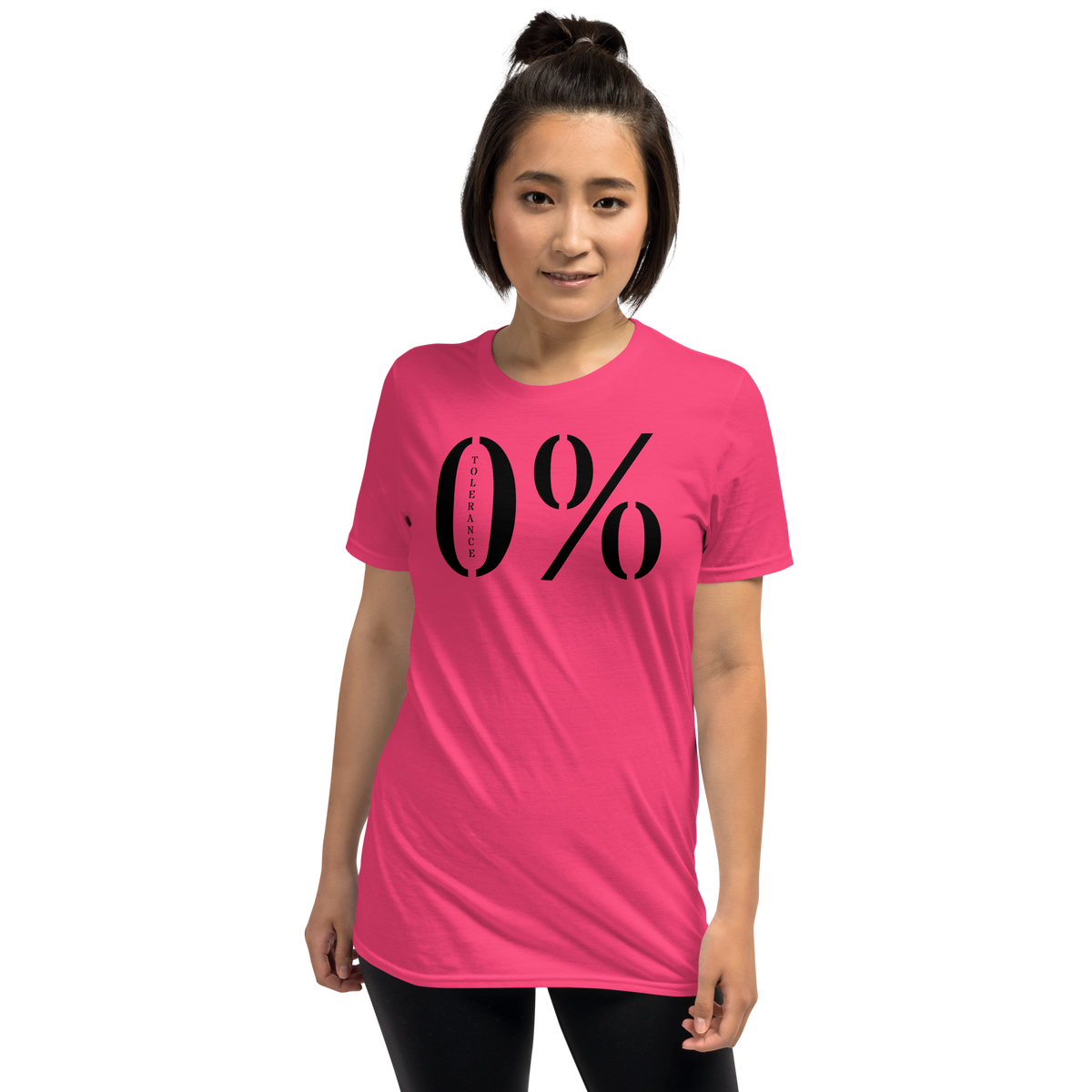 Model is wearing front facing graphic t-shirt in color heliconia pink featuring a large zero percent symbol and the written word, 'TOLERANCE', in bold black print. From What Was Said (Statement Apparel + More).