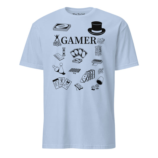 Front facing graphic T-shirt in color light blue, featuring printed image of  various classic board game pieces and the word 'GAMER' in black print, from What Was Said (Statement Apparel + More). 