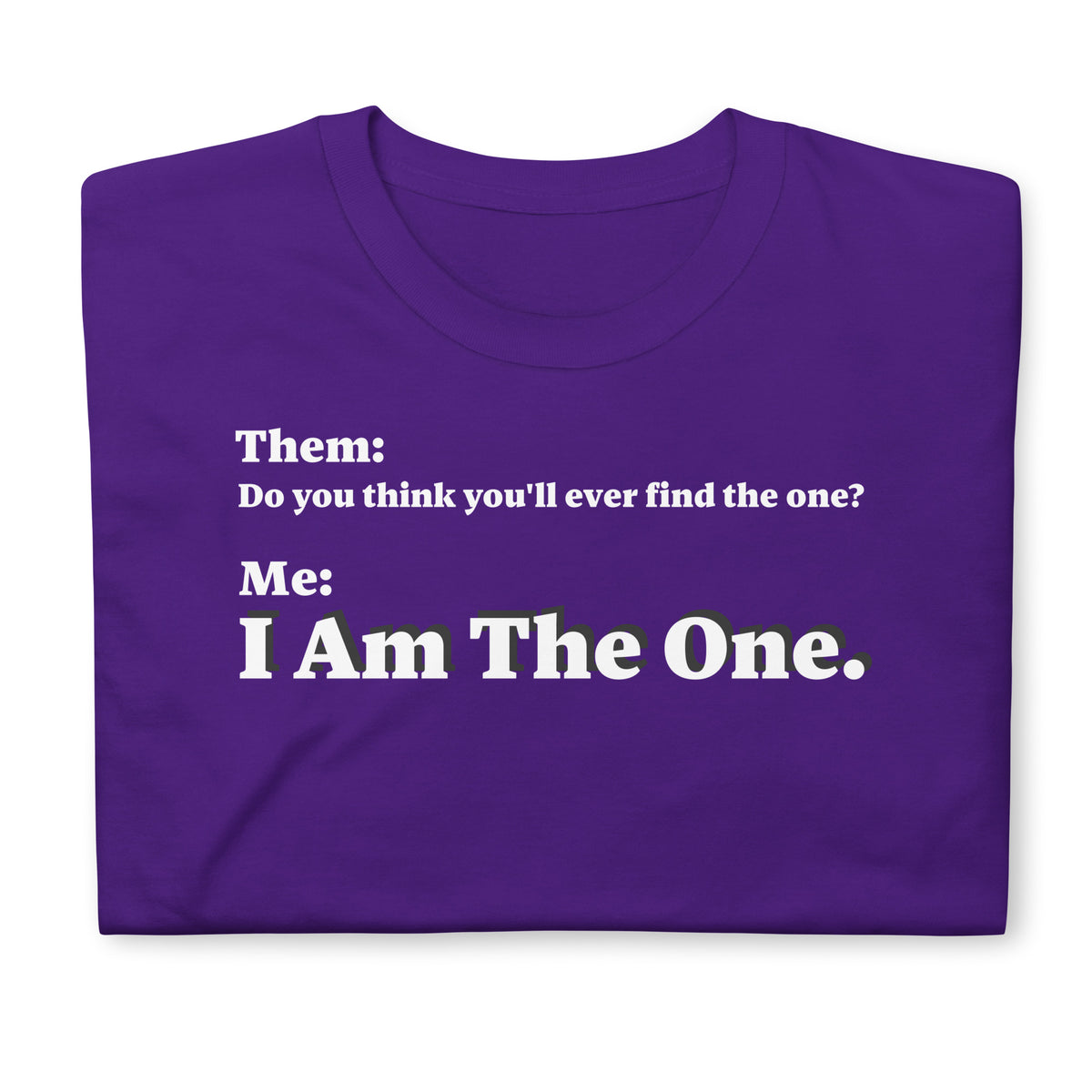 Folded front facing graphic T-shirt in color purple, featuring an asked question, 'Do you think you'll ever find the one?' and a response, 'I Am The One?' in bold white print, from What Was Said (Statement Apparel + More). 