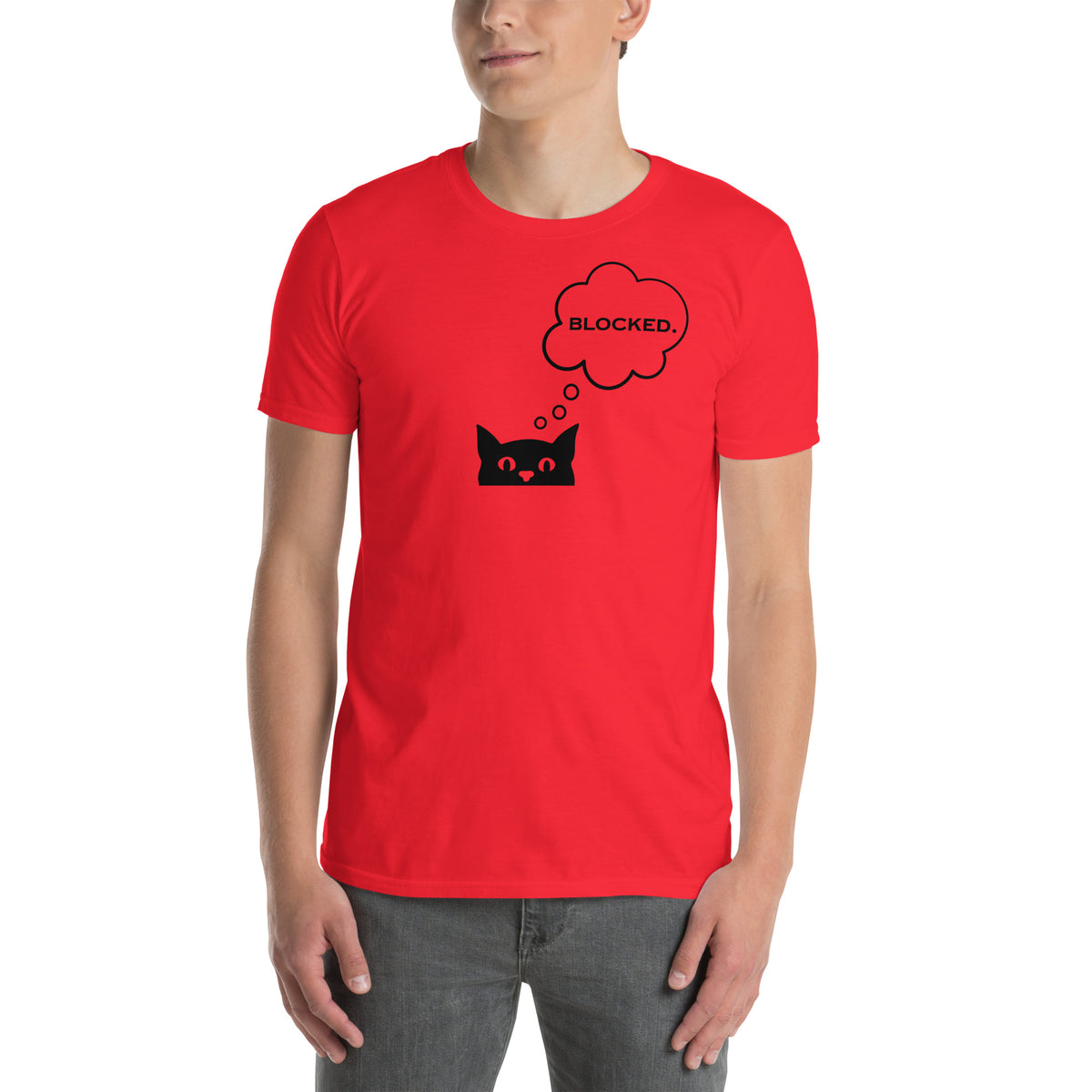 Model is wearing front facing graphic T-shirt in color red, featuring printed image of cat with thought bubble, and the written word 'BLOCKED', inside the bubble in black print. From What Was Said (Statement Apparel + More).