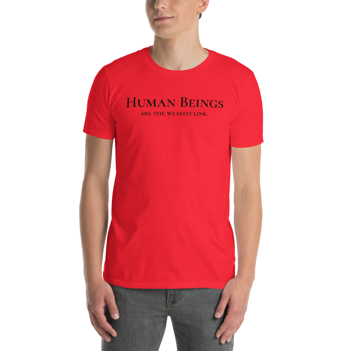 Model is wearing front facing graphic t-shirt in color red, featuring statement 'HUMAN BEINGS ARE THE WEAKEST LINK', in black print. From What Was Said (Statement Apparel + More).