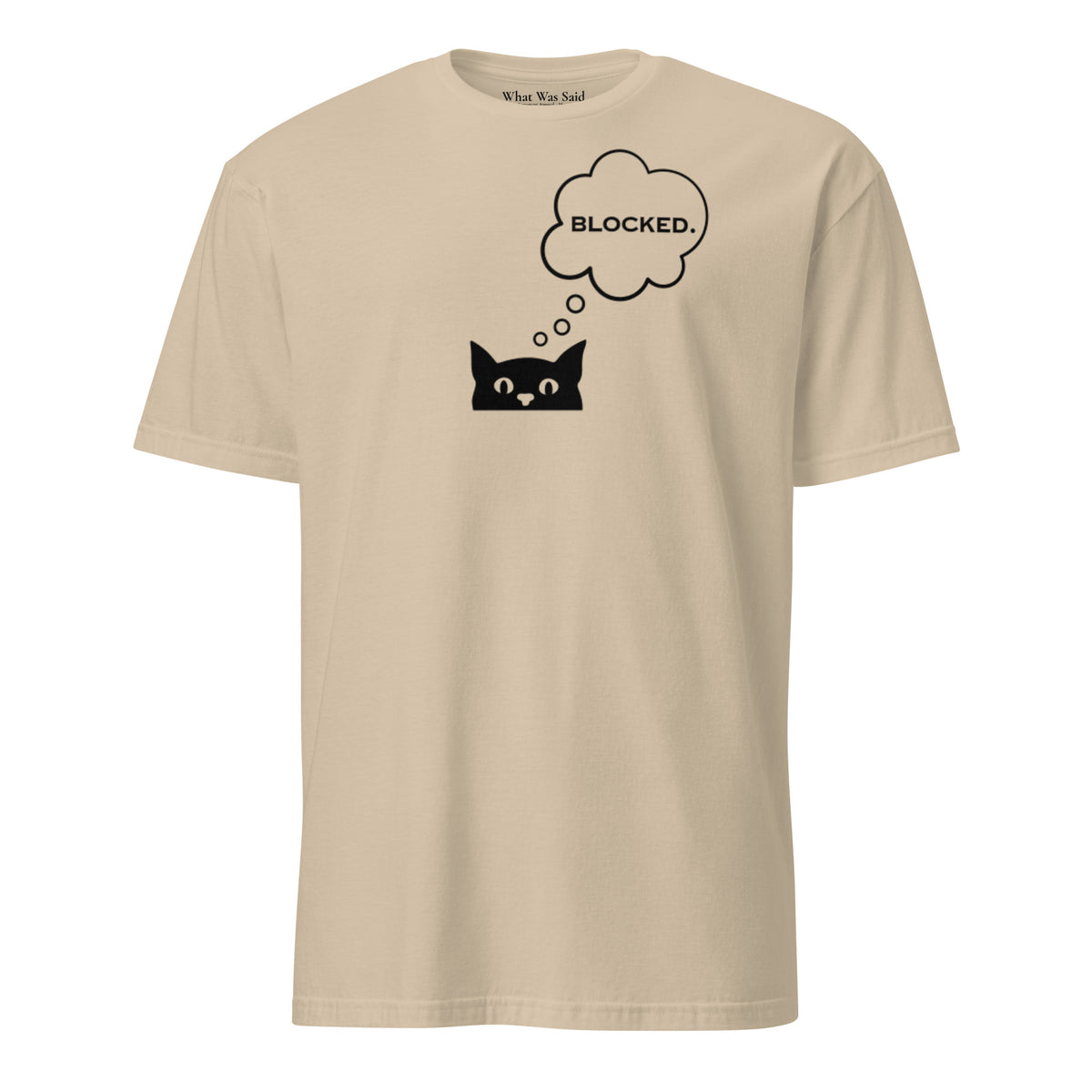 Front facing graphic T-shirt in color sand, featuring printed image of cat with thought bubble, and the written word 'BLOCKED', inside the bubble in black print. From What Was Said (Statement Apparel + More). 