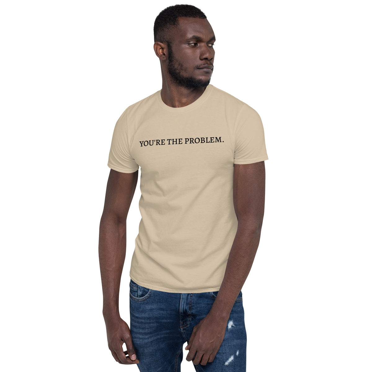 Model is wearing front facing graphic t-shirt in color sand featuring statement, 'YOU'RE THE PROBLEM', in bold black print. From What Was Said (Statement Apparel + More).