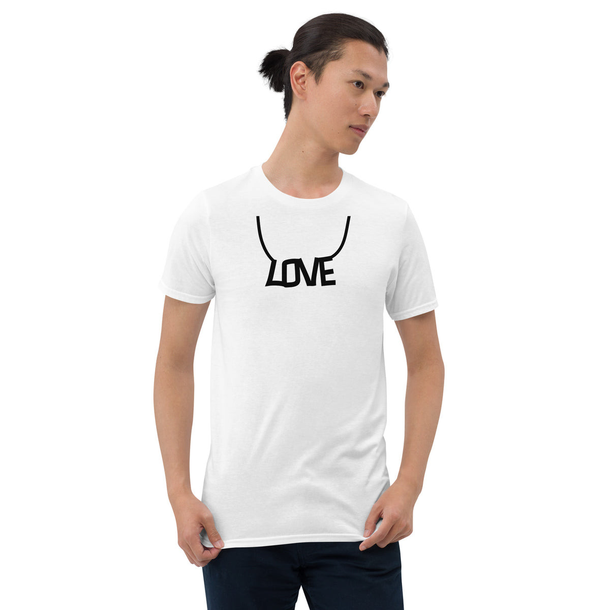 Model is wearing front facing graphic T-shirt in color white, featuring printed image of the written word 'LOVE' as a necklace, in black print. From What Was Said (Statement Apparel + More).