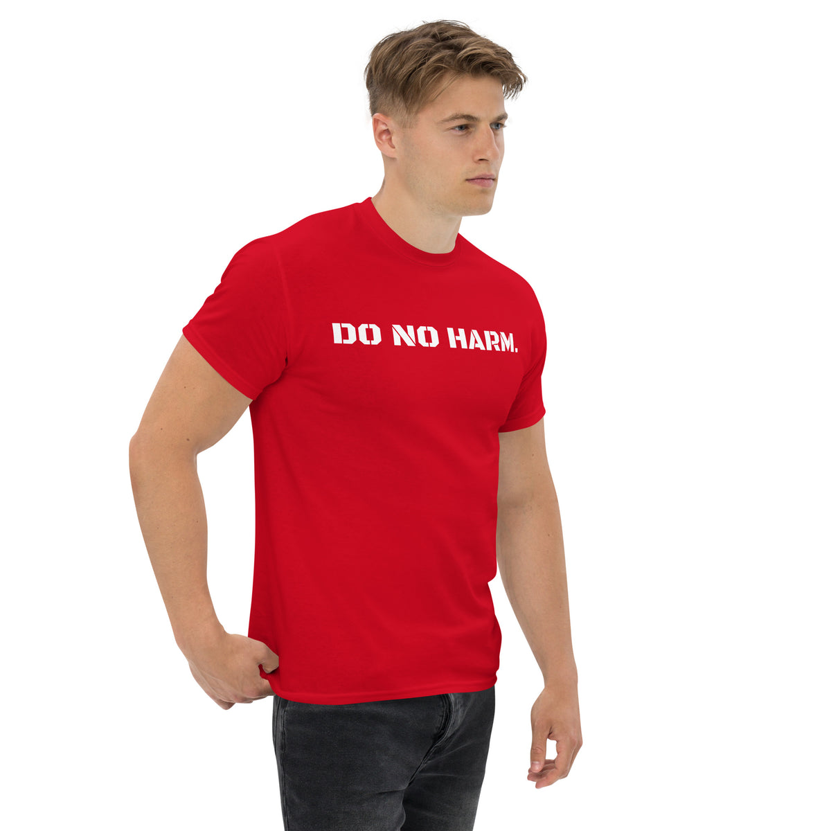 Model is wearing right front facing graphic t-shirt in color red, featuring statement 'DO NO HARM', in bold white print. From What Was Said (Statement Apparel + More).
