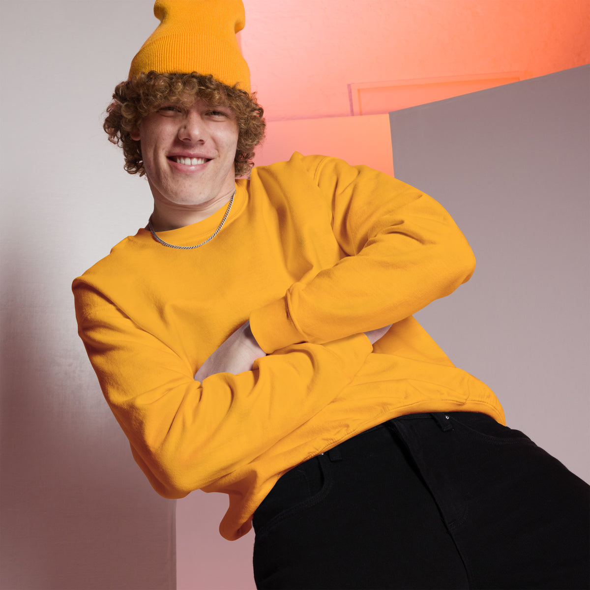 Model wearing front facing graphic sweatshirt in color gold yellow, from What Was Said (Statement Apparel + More). 